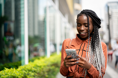 Picture of young African American woman on mobile phone