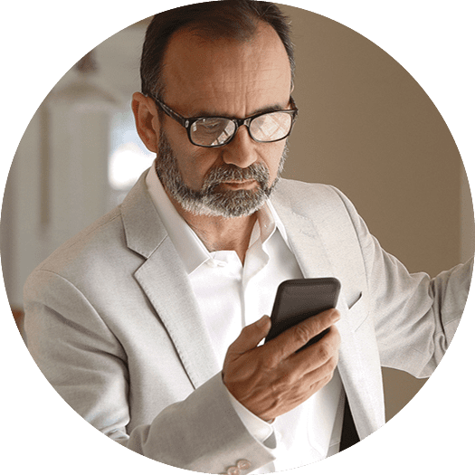 Middle aged man using phone for online medical treatment
