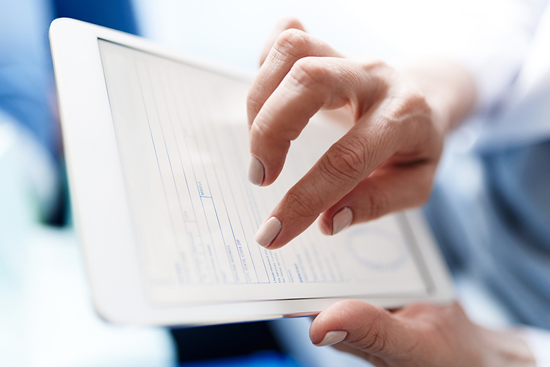 Patient or online doctor using a tablet computer. Patient may be requesting an online prescription refill or other service e.g. motion sickness prevention, COVID treatment with Paxlovid, urinary tract infection, UTI, bladder infection or yeast infection treatment. May be online doctor providing service.